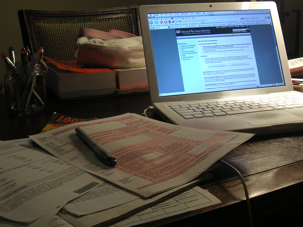 computer with tax forms