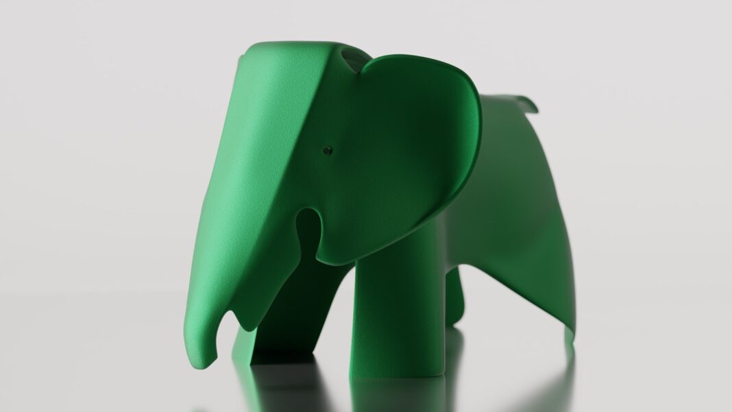 A bright green elephant sculpture stands proudly.