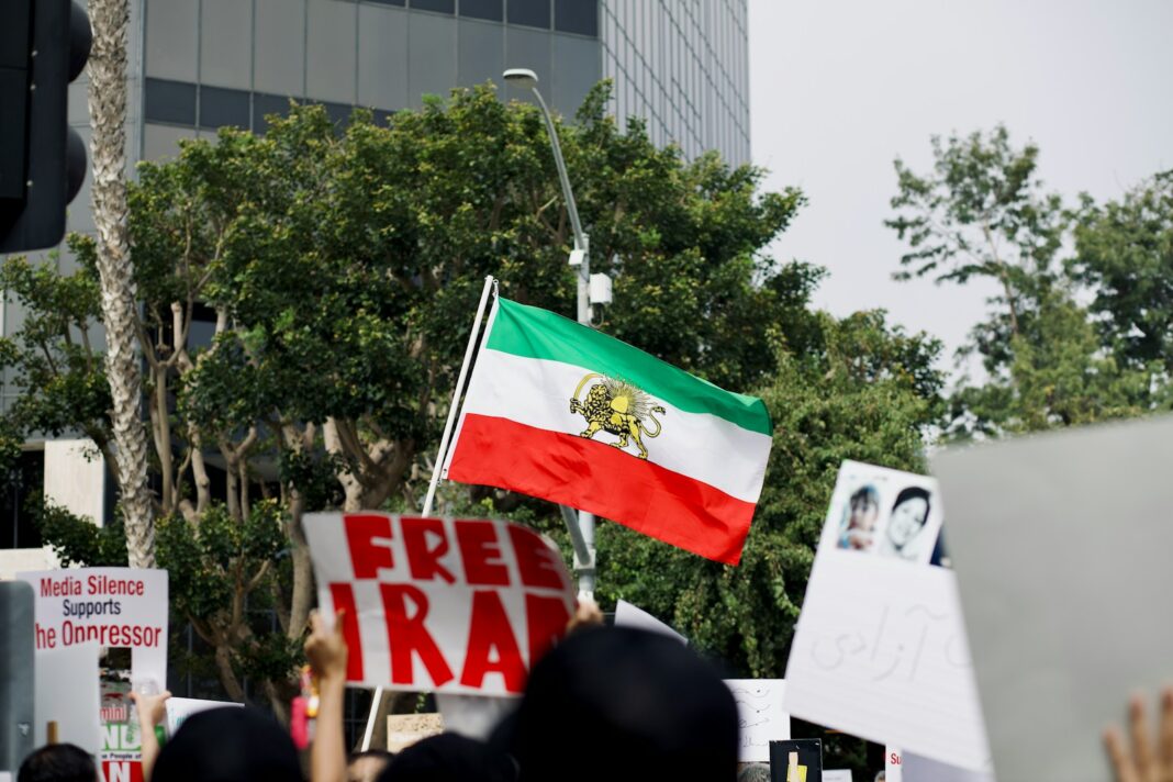 a group of people holding signs and flags