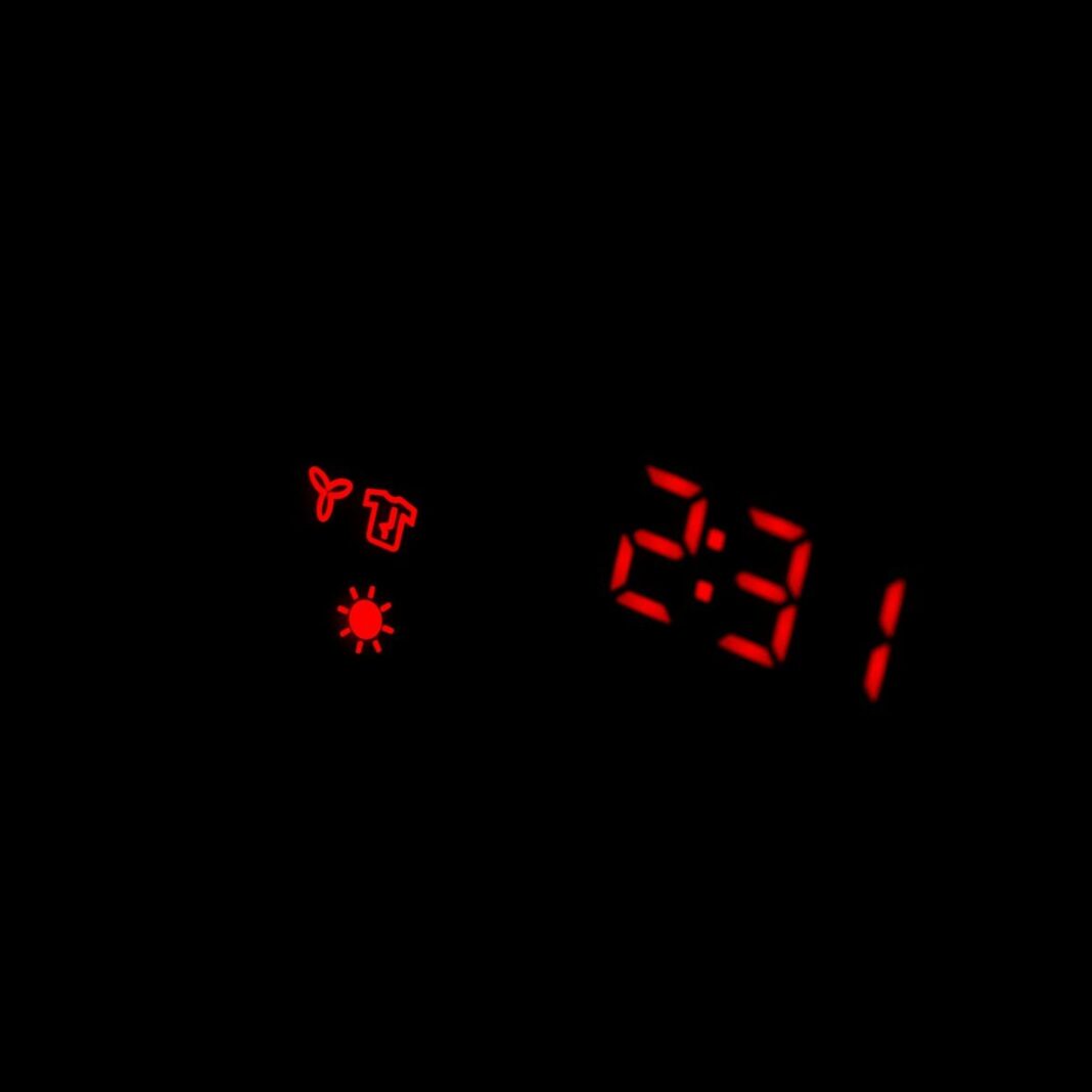 a digital clock with red numbers on a black background
