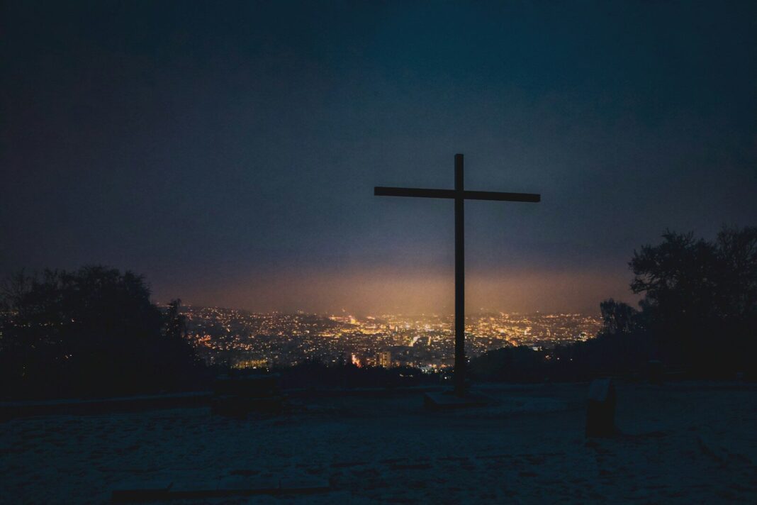 silhouette of cross during sunset